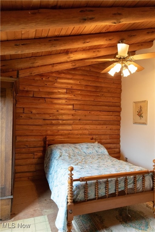 unfurnished bedroom featuring beamed ceiling, ceiling fan, and wood ceiling