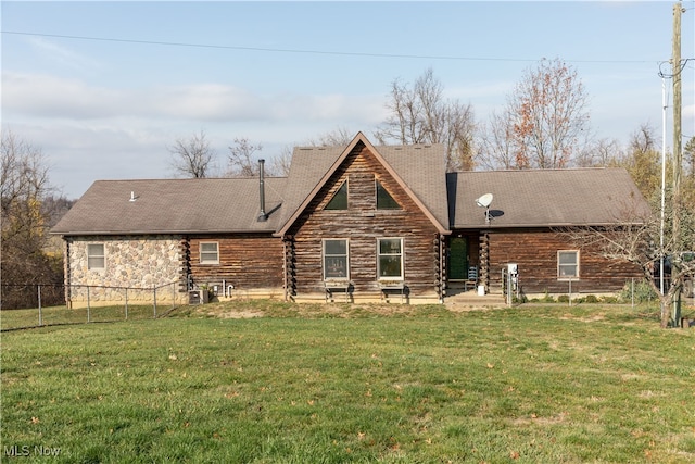 rear view of house featuring a yard and a patio area