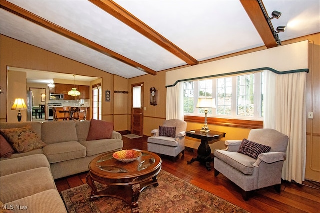 living room featuring vaulted ceiling with beams and dark hardwood / wood-style flooring