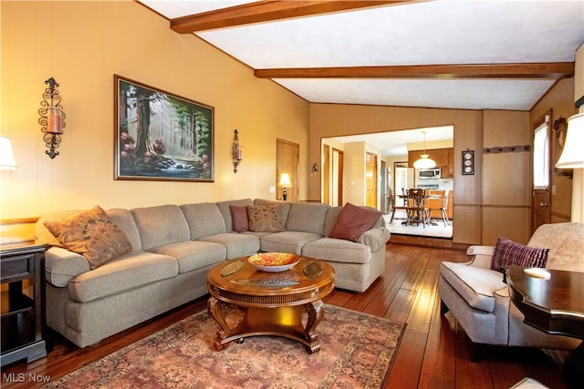 living room with lofted ceiling with beams and dark wood-type flooring