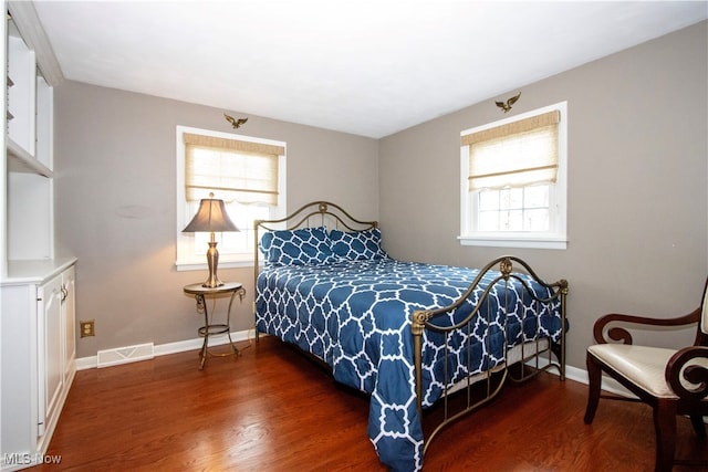 bedroom featuring dark hardwood / wood-style flooring