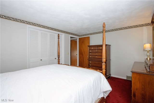 bedroom featuring dark carpet