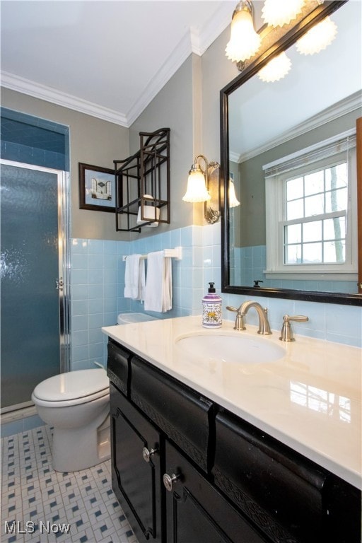 bathroom with tile patterned floors, crown molding, vanity, and an enclosed shower