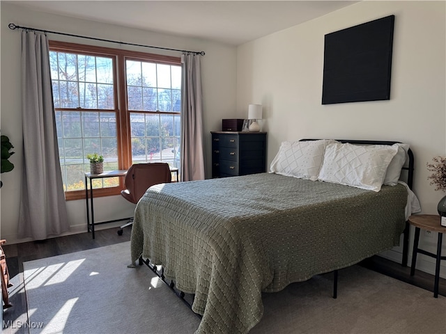 bedroom with hardwood / wood-style flooring