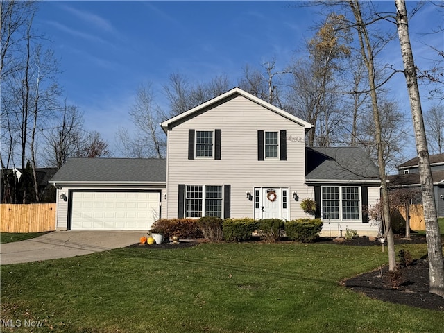 view of front facade with a garage and a front lawn