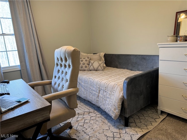 bedroom featuring light carpet