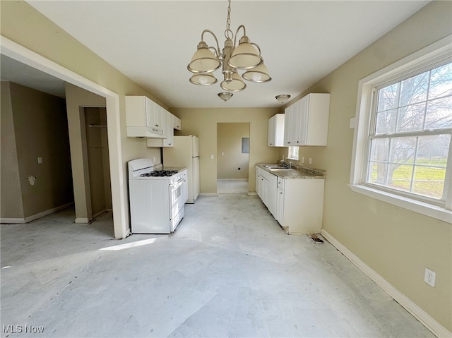 kitchen featuring a notable chandelier, white cabinetry, white appliances, and sink