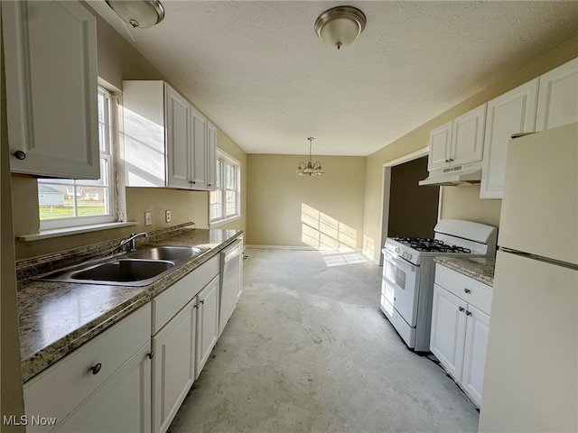 kitchen with sink, white cabinets, and white appliances