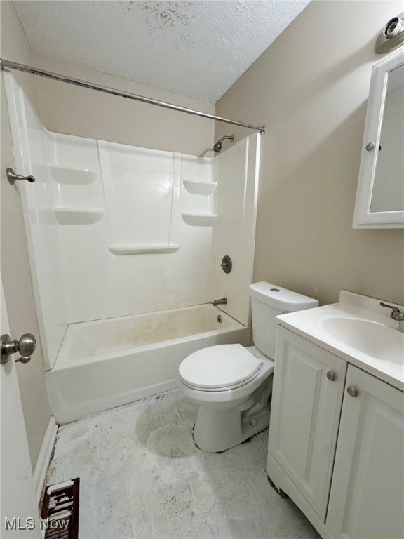 full bathroom featuring concrete floors, vanity, toilet, bathing tub / shower combination, and a textured ceiling