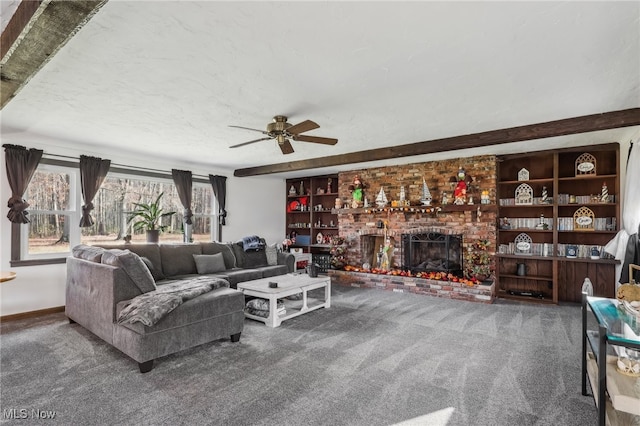 carpeted living room featuring ceiling fan, a textured ceiling, and a brick fireplace