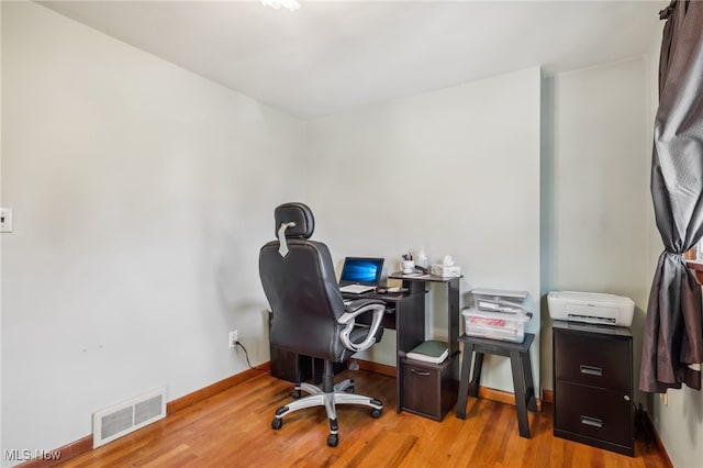 office space featuring light wood-type flooring