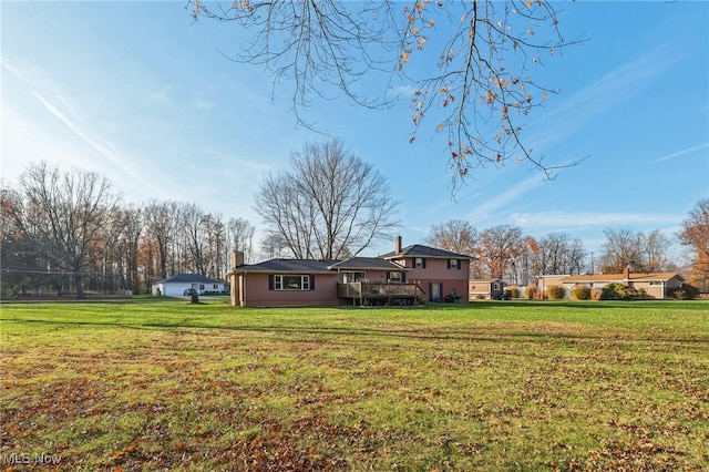 view of yard featuring a wooden deck