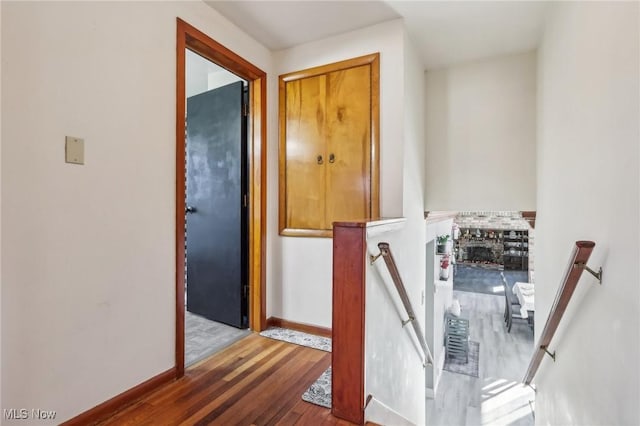 2500 Douglas Rd, Ashtabula, OH 44004 - hall featuring an upstairs landing, wood finished floors, and baseboards