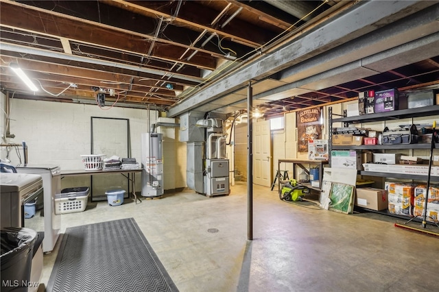 basement with separate washer and dryer, water heater, and heating unit