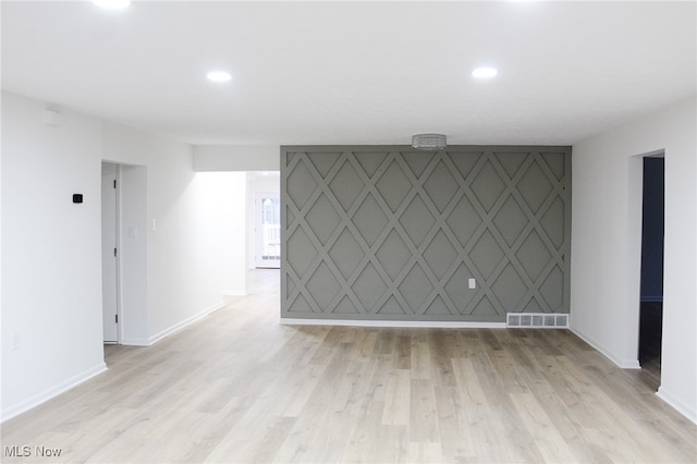 spare room featuring light hardwood / wood-style floors