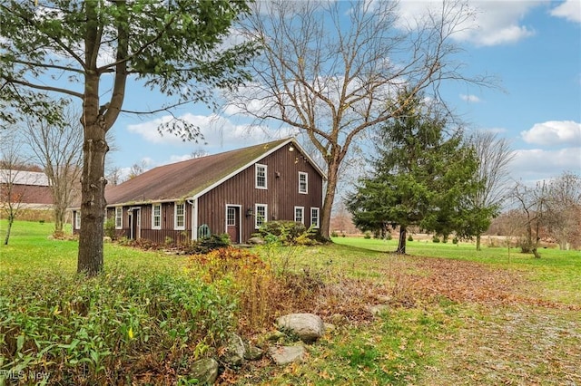 view of property exterior featuring a yard