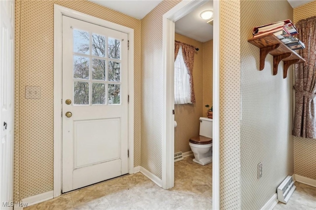 entryway with baseboards, light tile patterned flooring, and wallpapered walls