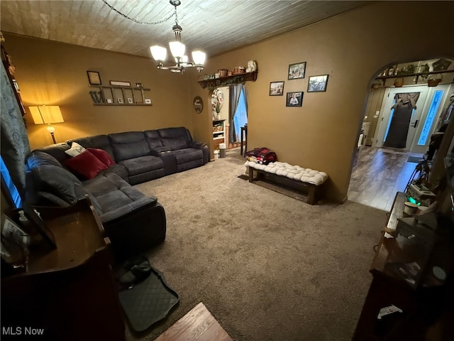 living room featuring hardwood / wood-style floors and a notable chandelier