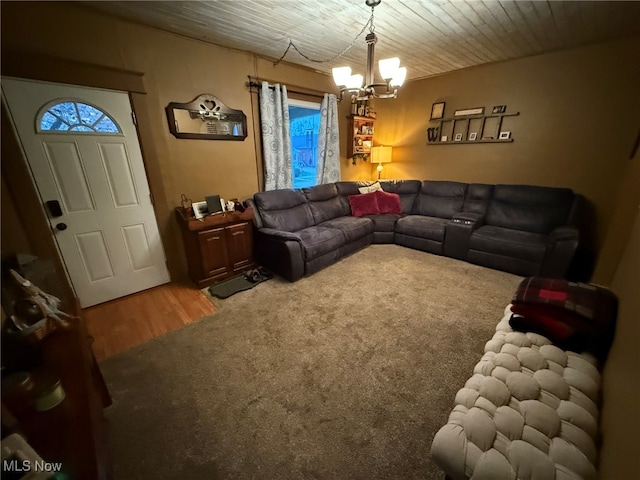 living room with hardwood / wood-style flooring and a notable chandelier