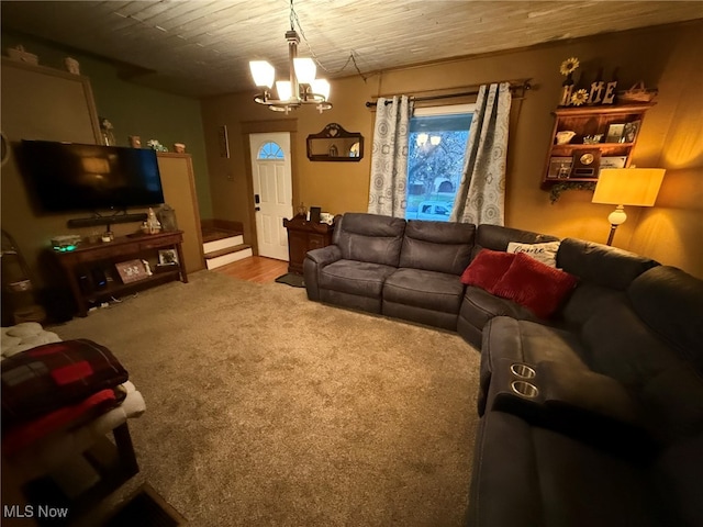 carpeted living room featuring an inviting chandelier