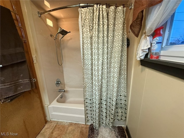 bathroom with shower / bath combination with curtain