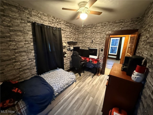 bedroom with hardwood / wood-style flooring and ceiling fan