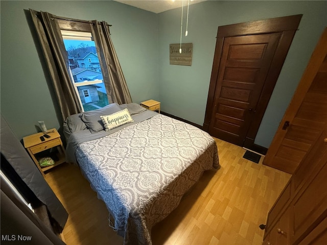 bedroom with light wood-type flooring