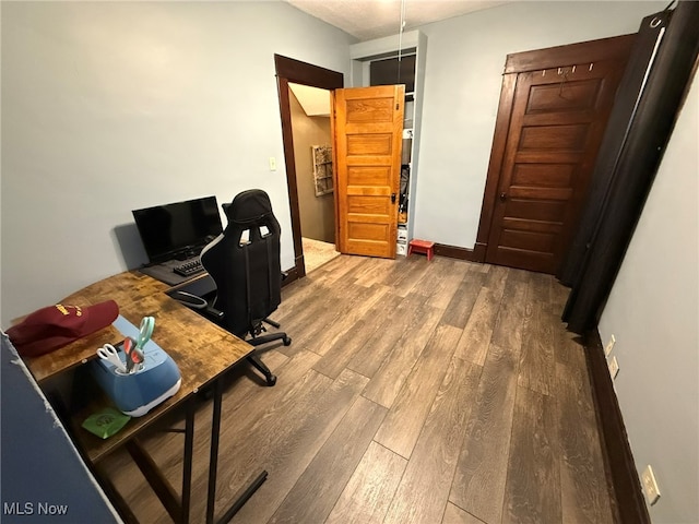 office with hardwood / wood-style floors