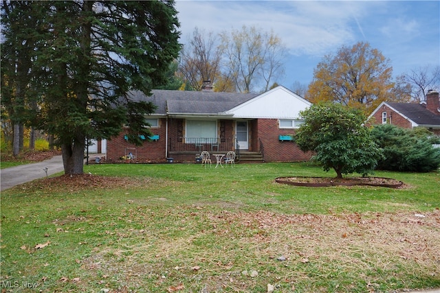 ranch-style house with a front lawn