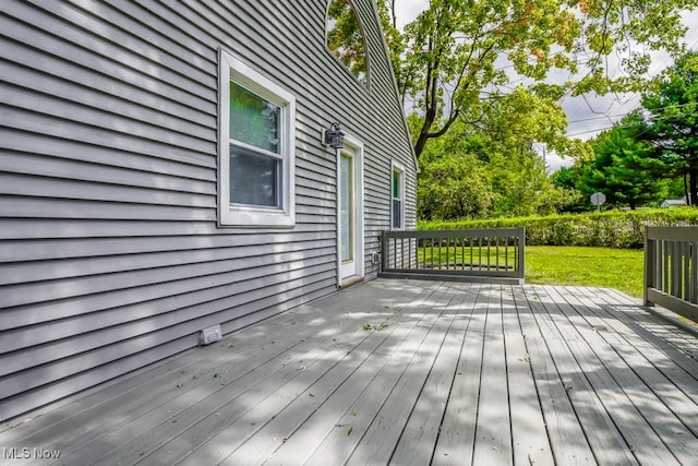 deck featuring a lawn