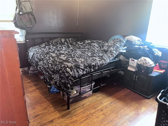 bedroom with wood-type flooring