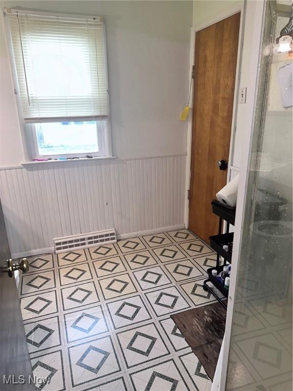 2908 Columbus Ave, Ashtabula, OH 44004 - bathroom featuring wainscoting and a shower stall