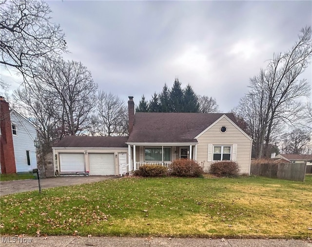 single story home featuring a front yard and a garage