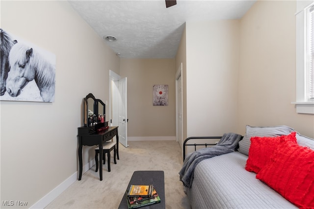 carpeted bedroom featuring a textured ceiling