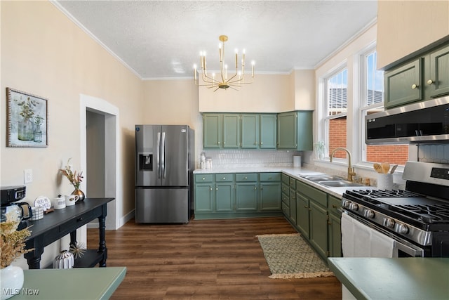 kitchen featuring dark wood-type flooring, stainless steel appliances, and green cabinetry