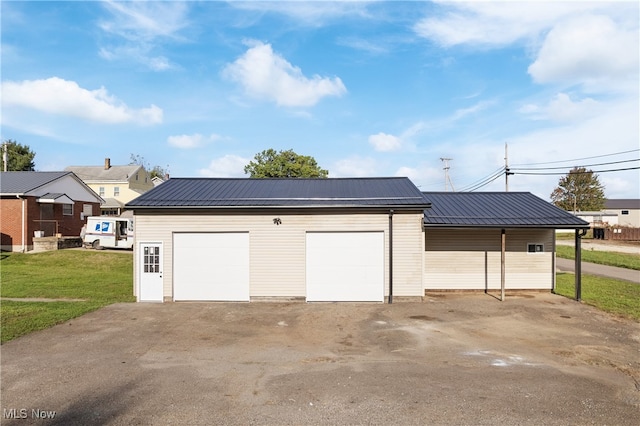 garage featuring a lawn