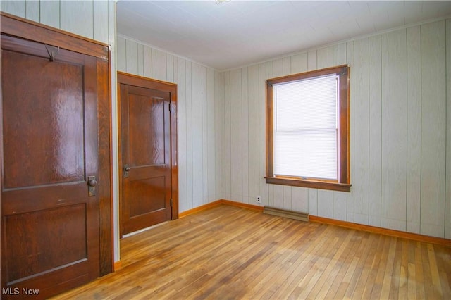 spare room featuring light hardwood / wood-style flooring