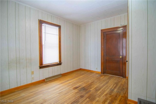 spare room featuring hardwood / wood-style floors