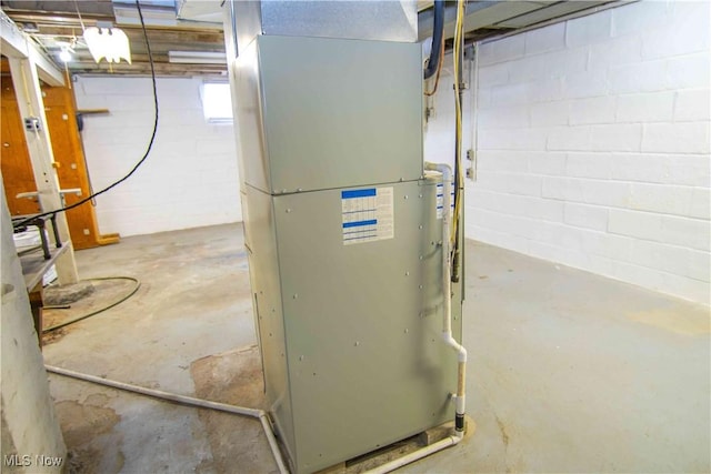 utility room featuring heating unit