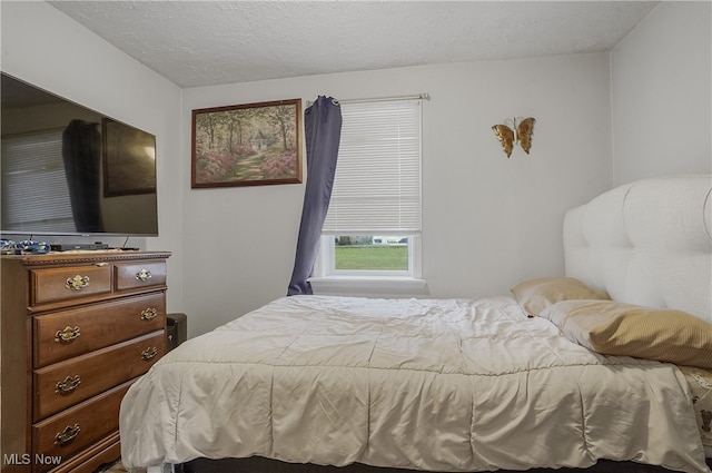 bedroom featuring a textured ceiling