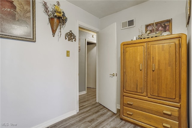 unfurnished bedroom with light wood-type flooring