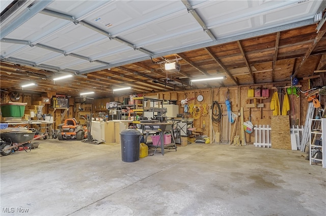 garage featuring a workshop area and a garage door opener