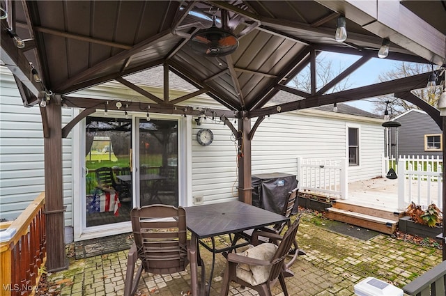 exterior space featuring a gazebo and a deck