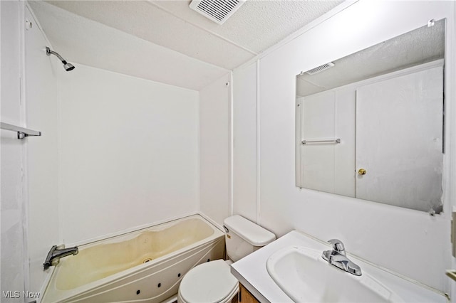 full bathroom with bathtub / shower combination, vanity, toilet, and a textured ceiling