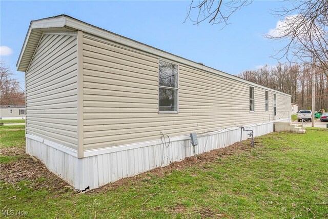 3583 Austin Dr Unit 94, Geneva, OH 44041 - view of side of home with a lawn