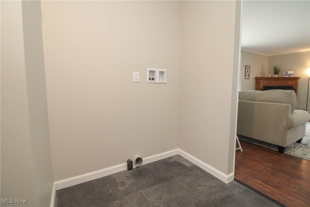 laundry area featuring washer hookup and dark wood-type flooring