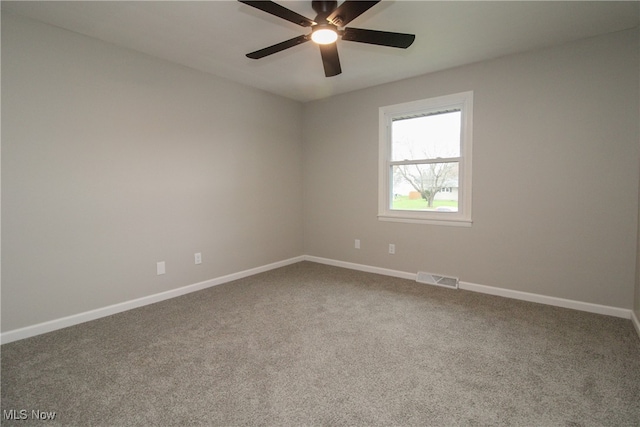 empty room with carpet flooring and ceiling fan