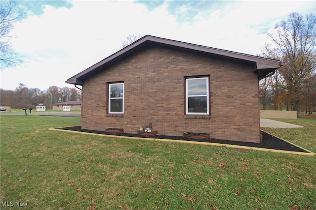 view of home's exterior featuring a yard