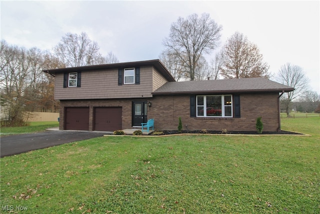 view of front of house featuring a garage and a front yard