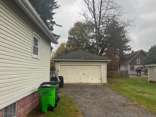 garage featuring a yard